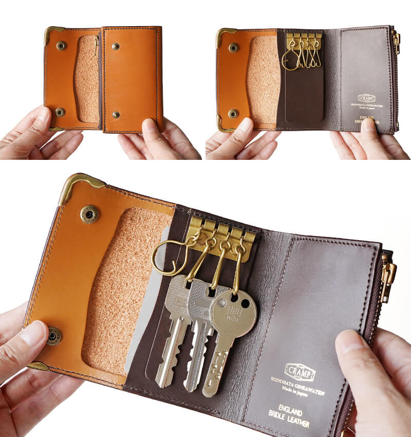 開閉はシンプルなホックボタン式。開けると中央にキーリングが4つ、右側にコインケースがあります。